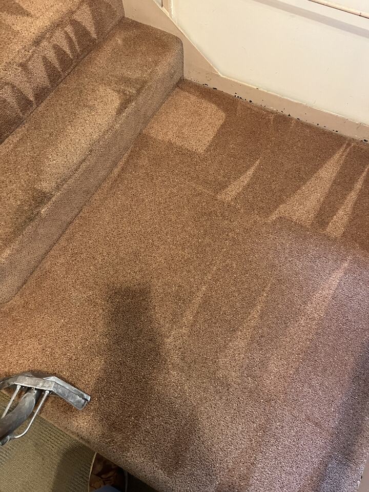 The same stair landing after treatment, with the dark spot no longer visible